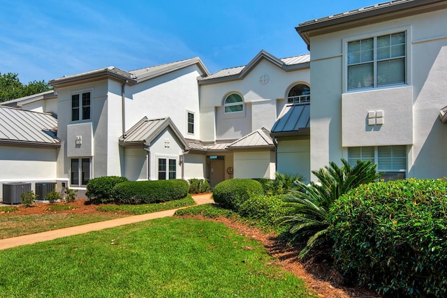 961 Northshore Dr, Miramar Beach, FL 32550 - view of front of home featuring a standing seam roof, a metal roof, and a front yard