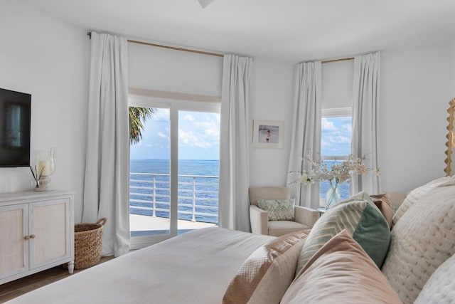 961 Northshore Dr, Miramar Beach, FL 32550 - bedroom featuring multiple windows, access to outside, a water view, and wood finished floors