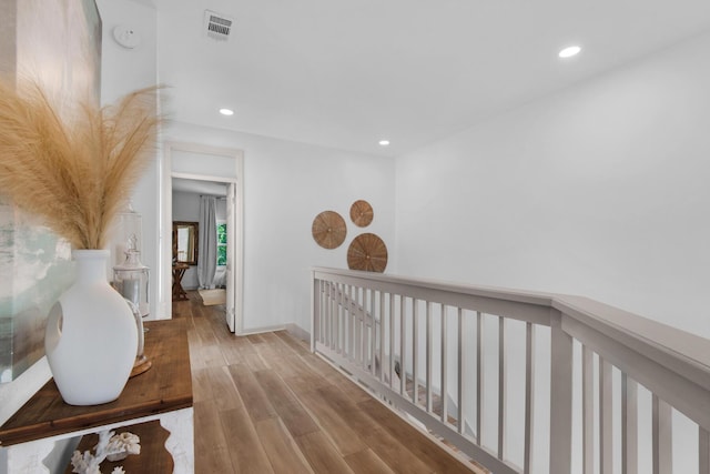 961 Northshore Dr, Miramar Beach, FL 32550 - corridor with recessed lighting, wood finished floors, and an upstairs landing