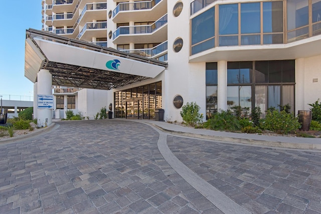 1096 Scenic Gulf Dr Unit 311, Miramar Beach, FL 32550 - view of building exterior with a carport and driveway