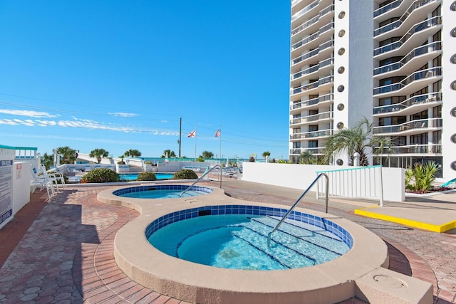 1096 Scenic Gulf Dr Unit 311, Miramar Beach, FL 32550 - view of pool featuring a community hot tub and a swimming pool