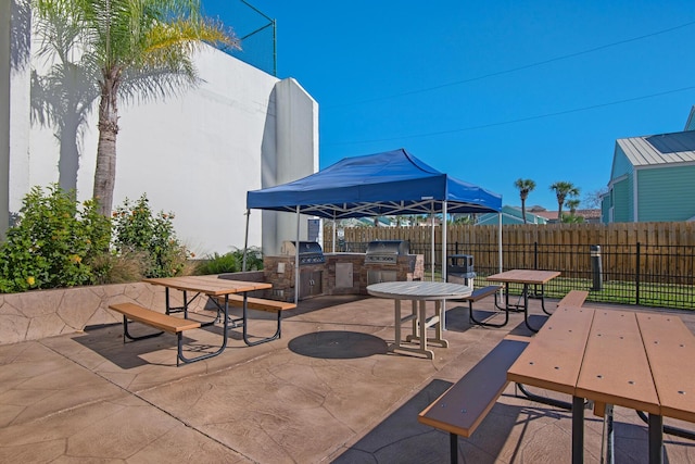 1096 Scenic Gulf Dr Unit 311, Miramar Beach, FL 32550 - view of patio with exterior kitchen