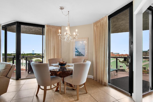 1096 Scenic Gulf Dr Unit 311, Miramar Beach, FL 32550 - dining room with a wall of windows, a chandelier, and light tile patterned floors