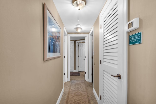 1096 Scenic Gulf Dr Unit 311, Miramar Beach, FL 32550 - hall with baseboards and light tile patterned floors