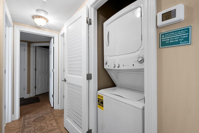 1096 Scenic Gulf Dr Unit 311, Miramar Beach, FL 32550 - washroom with stacked washing machine and dryer and light tile patterned floors