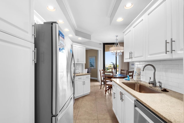 1096 Scenic Gulf Dr Unit 311, Miramar Beach, FL 32550 - kitchen featuring stainless steel appliances, crown molding, backsplash, white cabinets, and recessed lighting