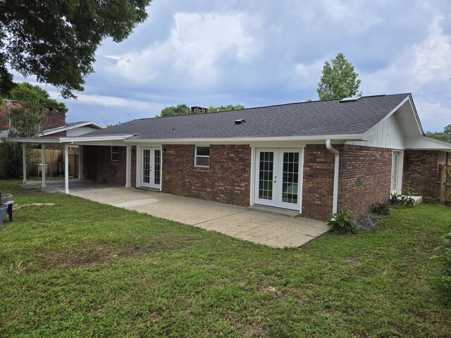 726 Clark Dr, Fort Walton Beach, FL 32547 - rear view of property featuring french doors, brick siding, and a yard