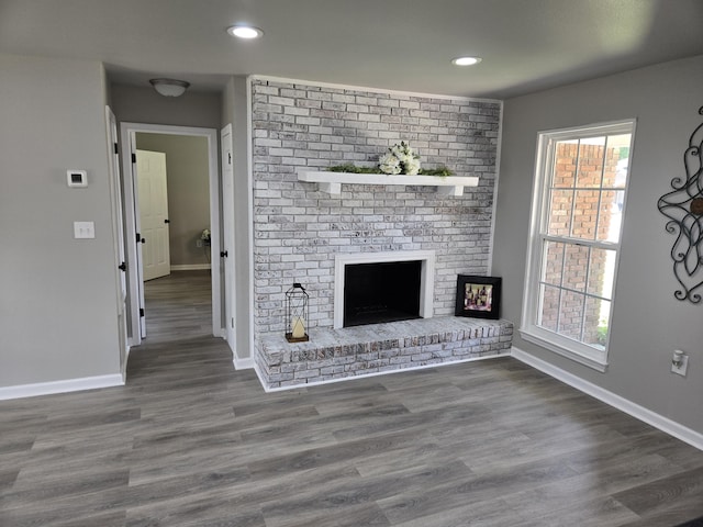 726 Clark Dr, Fort Walton Beach, FL 32547 - unfurnished living room featuring a fireplace, wood finished floors, and recessed lighting