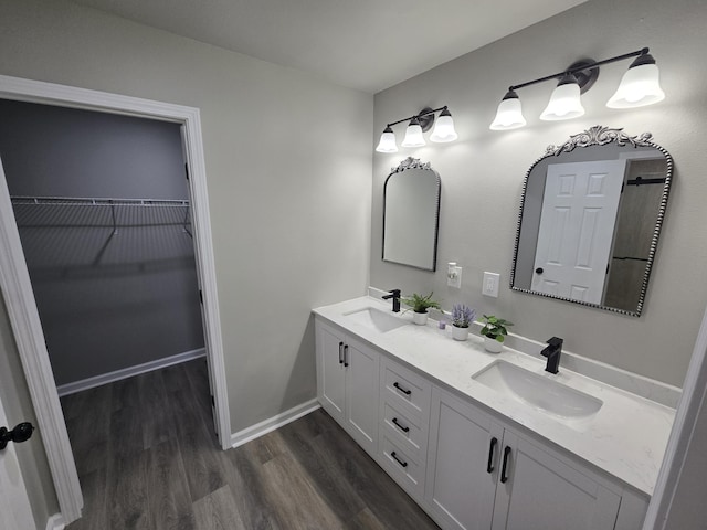 726 Clark Dr, Fort Walton Beach, FL 32547 - full bath featuring double vanity, wood finished floors, and a spacious closet