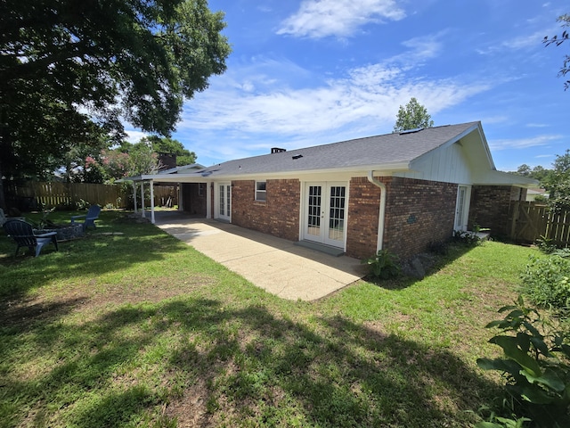 726 Clark Dr, Fort Walton Beach, FL 32547 - back of house featuring french doors, brick siding, and a patio