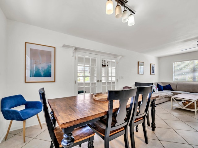 92 Tarpon St, Destin, FL 32541 - dining space featuring french doors and light tile patterned floors