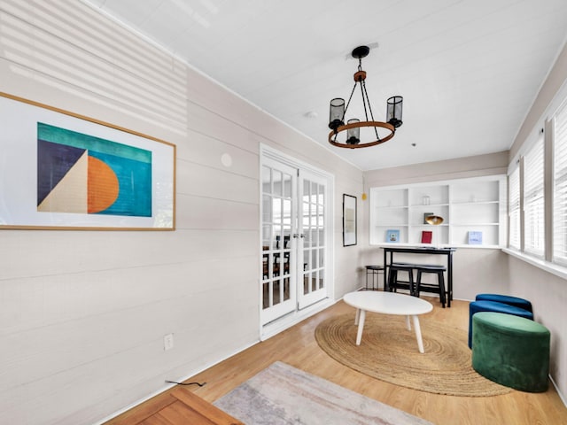 92 Tarpon St, Destin, FL 32541 - sitting room with a chandelier and wood finished floors