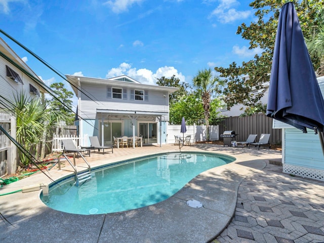 92 Tarpon St, Destin, FL 32541 - view of pool featuring a patio, a fenced backyard, and grilling area