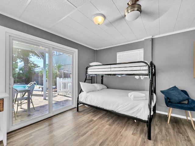 92 Tarpon St, Destin, FL 32541 - bedroom featuring access to outside, wood finished floors, and crown molding