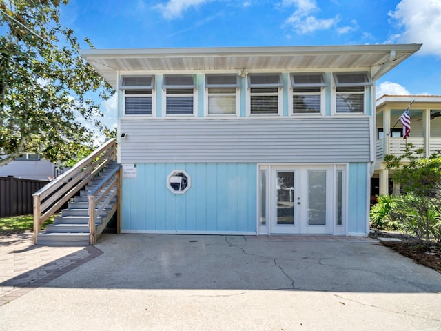 92 Tarpon St, Destin, FL 32541 - view of front of home with french doors and stairs