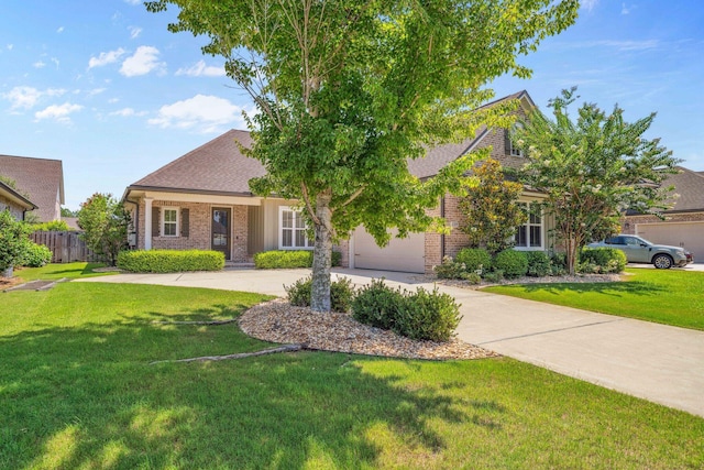 129 Meadow Lake Dr, Freeport, FL 32439 - view of front of house featuring brick siding, driveway, an attached garage, and a shingled roof