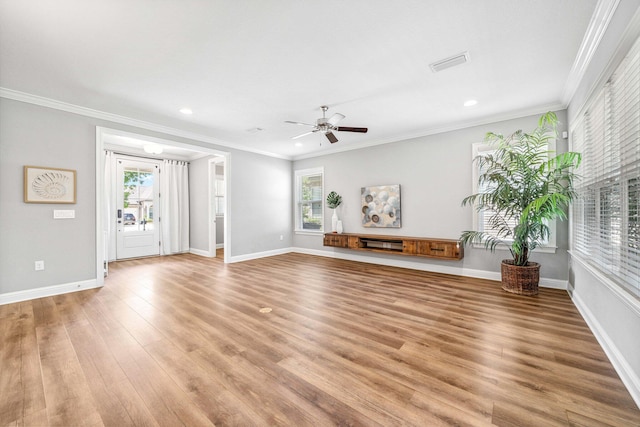 129 Meadow Lake Dr, Freeport, FL 32439 - unfurnished living room featuring light wood finished floors, plenty of natural light, ceiling fan, recessed lighting, and crown molding
