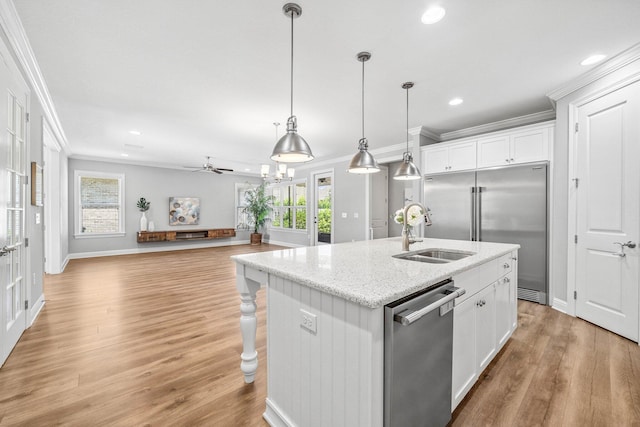 129 Meadow Lake Dr, Freeport, FL 32439 - kitchen with appliances with stainless steel finishes, crown molding, recessed lighting, plenty of natural light, and an island with sink