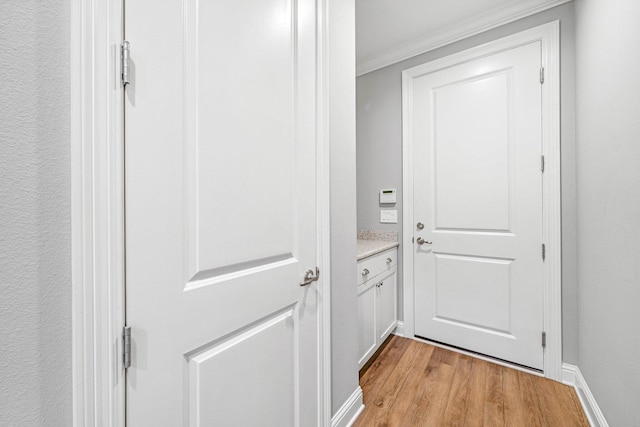 129 Meadow Lake Dr, Freeport, FL 32439 - doorway to outside featuring light wood-type flooring and ornamental molding