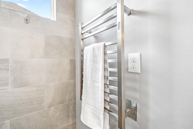 129 Meadow Lake Dr, Freeport, FL 32439 - full bath featuring a towel warmer and a tile shower