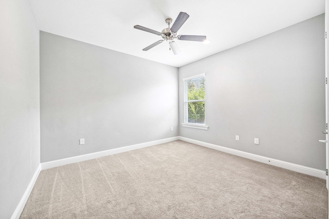 129 Meadow Lake Dr, Freeport, FL 32439 - carpeted spare room with baseboards and ceiling fan