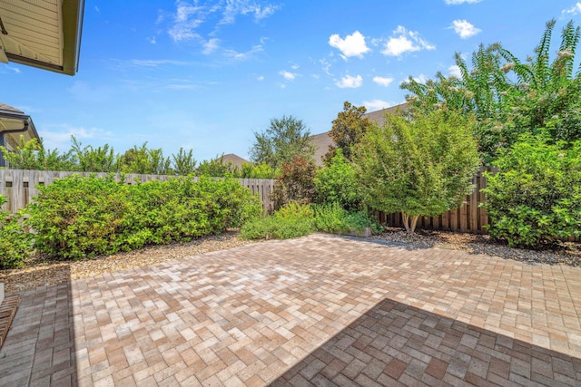 129 Meadow Lake Dr, Freeport, FL 32439 - fenced backyard featuring a patio area