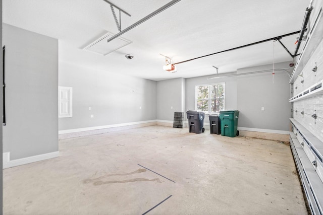 129 Meadow Lake Dr, Freeport, FL 32439 - garage featuring a garage door opener and baseboards