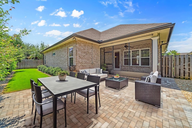 129 Meadow Lake Dr, Freeport, FL 32439 - fenced backyard with a patio area, an outdoor living space, and a ceiling fan