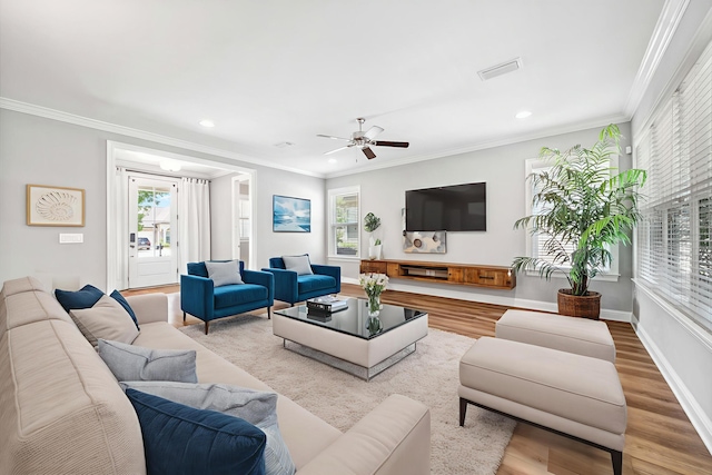 129 Meadow Lake Dr, Freeport, FL 32439 - living area with healthy amount of natural light, wood finished floors, crown molding, recessed lighting, and ceiling fan