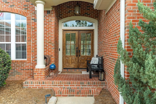 180 Gulf Pines Ct, Freeport, FL 32439 - property entrance featuring french doors and brick siding