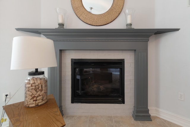 180 Gulf Pines Ct, Freeport, FL 32439 - detailed view of a glass covered fireplace and baseboards