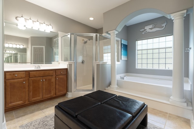 180 Gulf Pines Ct, Freeport, FL 32439 - full bathroom featuring decorative columns, a stall shower, vanity, a bath, and tile patterned floors