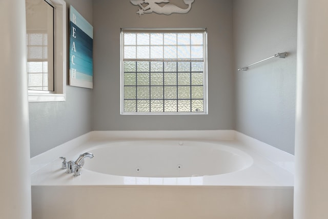 180 Gulf Pines Ct, Freeport, FL 32439 - bathroom with healthy amount of natural light and a jetted tub