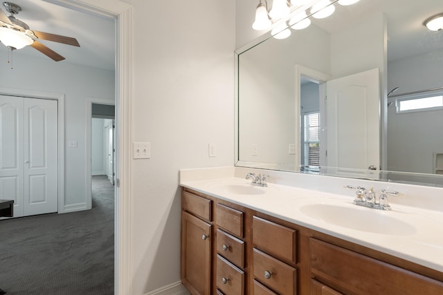 180 Gulf Pines Ct, Freeport, FL 32439 - full bathroom with double vanity, plenty of natural light, and a ceiling fan