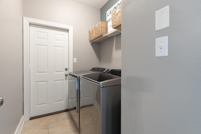 180 Gulf Pines Ct, Freeport, FL 32439 - laundry area featuring washer and clothes dryer and light tile patterned flooring