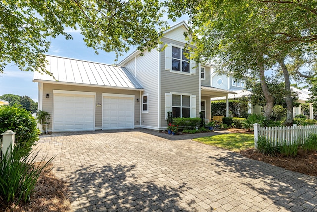 2077 Olde Towne Ave, Miramar Beach, FL 32550 - view of front facade featuring a standing seam roof, decorative driveway, an attached garage, and a metal roof