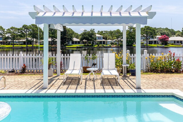 2077 Olde Towne Ave, Miramar Beach, FL 32550 - view of swimming pool featuring a water view, a pergola, and a patio area