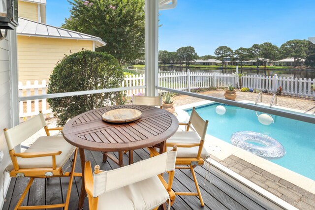 2077 Olde Towne Ave, Miramar Beach, FL 32550 - view of swimming pool featuring a water view and a fenced backyard