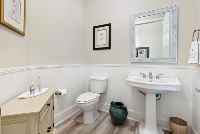 2077 Olde Towne Ave, Miramar Beach, FL 32550 - half bathroom with wood finished floors and a wainscoted wall