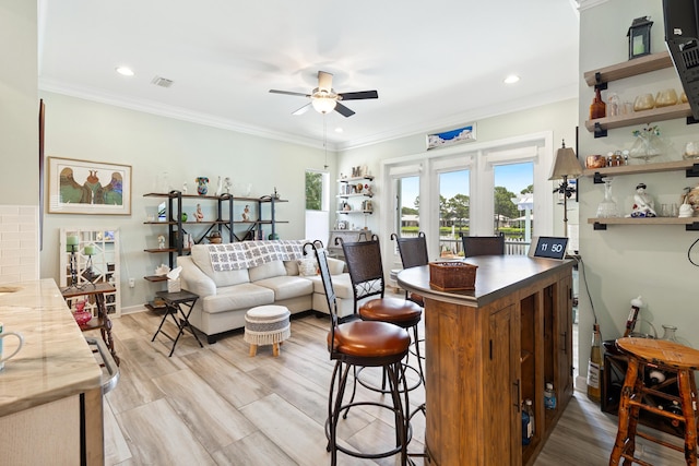 2077 Olde Towne Ave, Miramar Beach, FL 32550 - indoor dry bar with a ceiling fan, ornamental molding, light wood finished floors, and recessed lighting