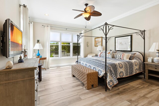 2077 Olde Towne Ave, Miramar Beach, FL 32550 - bedroom with crown molding, light wood finished floors, and ceiling fan