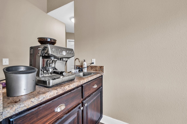 653 Territory Ln, Crestview, FL 32536 - bar area with a sink and baseboards