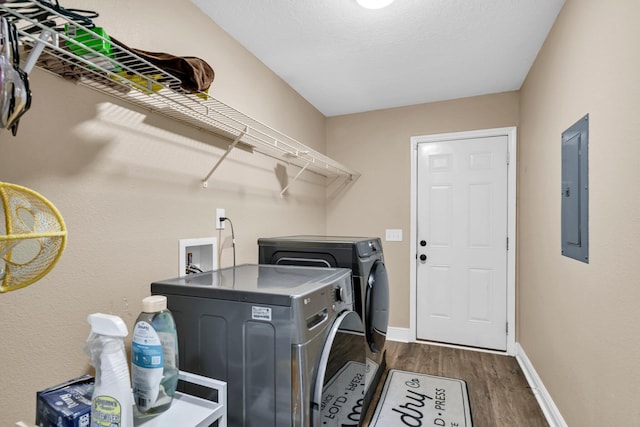 653 Territory Ln, Crestview, FL 32536 - laundry room featuring independent washer and dryer, dark wood-style flooring, and electric panel