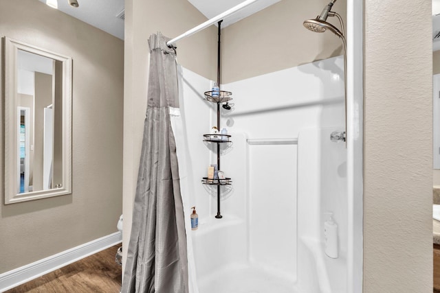 653 Territory Ln, Crestview, FL 32536 - bathroom with a stall shower and wood finished floors