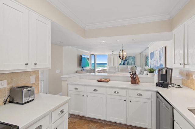 114 Mainsail Dr Unit 143, Miramar Beach, FL 32550 - kitchen with open floor plan, crown molding, a peninsula, stainless steel dishwasher, and backsplash