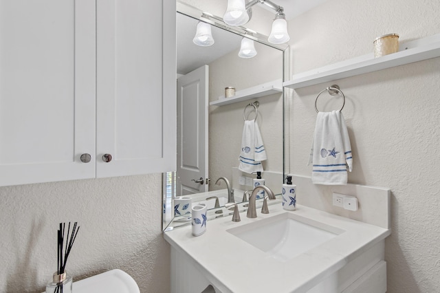 114 Mainsail Dr Unit 143, Miramar Beach, FL 32550 - bathroom featuring a textured wall and vanity