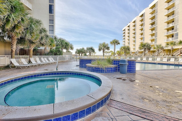 114 Mainsail Dr Unit 143, Miramar Beach, FL 32550 - community pool featuring a patio area