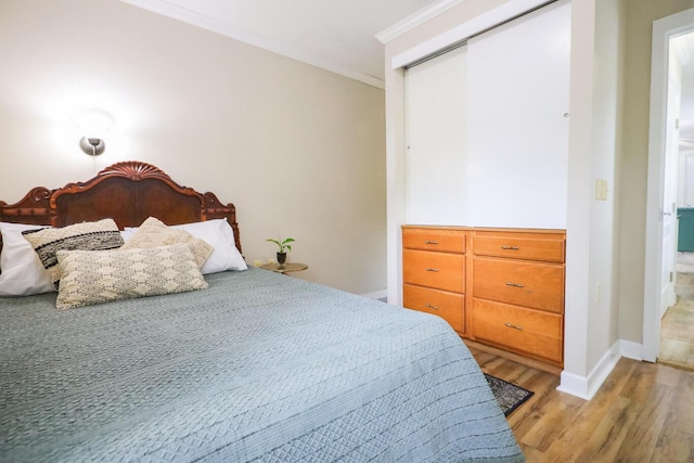 147-161 Caswell Branch Rd, Freeport, FL 32439 - bedroom featuring light wood finished floors, crown molding, and a closet