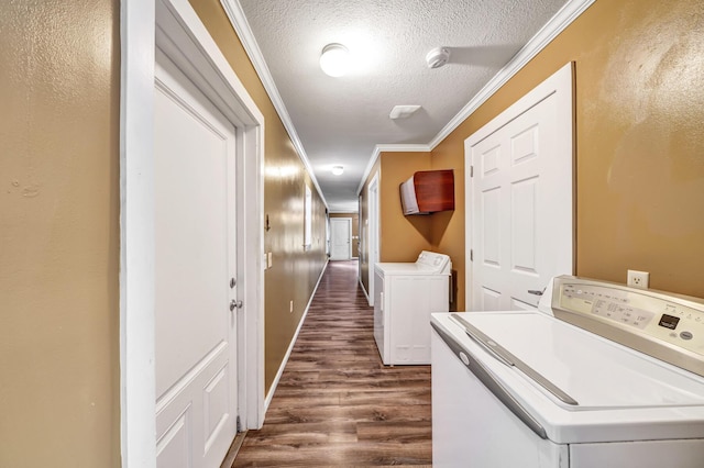 147-161 Caswell Branch Rd, Freeport, FL 32439 - laundry room with washing machine and dryer, a textured ceiling, ornamental molding, and dark wood-type flooring