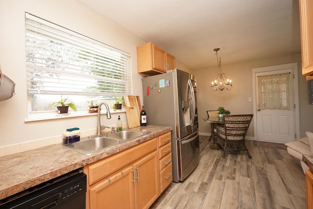 52 NE Iowa Dr, Fort Walton Beach, FL 32548 - kitchen with black dishwasher, stainless steel refrigerator with ice dispenser, light wood-type flooring, a chandelier, and pendant lighting